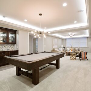 Basement with a pool table. 