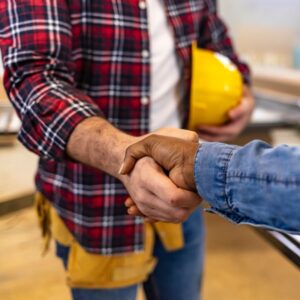 Person shaking hand with a contractor. 