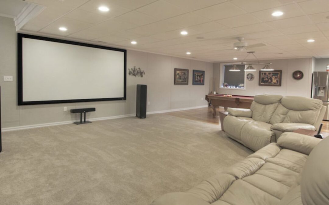 remodeled basement with projector screen